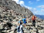Trekking through talus to start our climb...