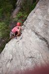 Calhoun rounds the arete on The Gift, quickdraw in his teeth...